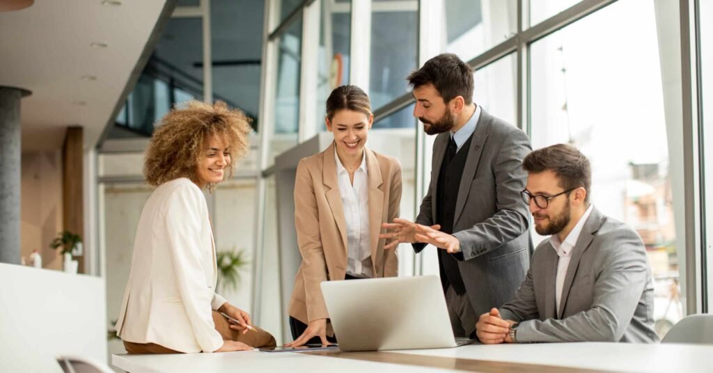 business-team-smiling-and-discussing-project-in-modern-office