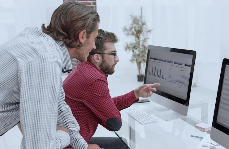 SEO specialists reviewing on-page SEO performance and content metrics for a fabrication shop website on a desktop screen.
